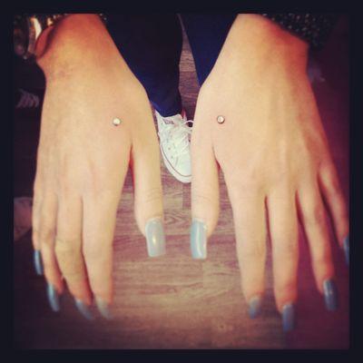 Dermal Hand Piercings.