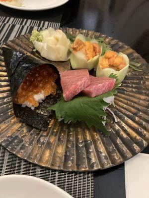 Ikura hand roll with uni and Toro