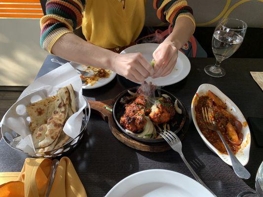 garlic naan, tandoori chicken, and the remnants of the idli stir fry