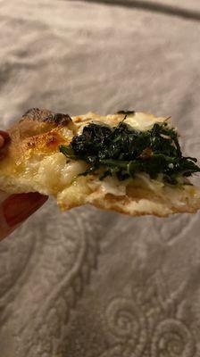 The perfect crust - spinach is cooked just right, not burnt like other places. Delish!