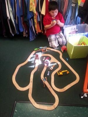 Matthew having fun with the racetrack.  He built it!!!