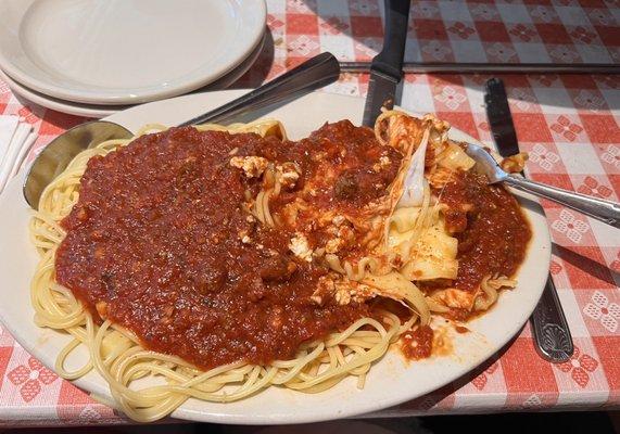 2 item plate. Spaghetti and lasagna with meat sauce  We were also served warm French bread and butter.