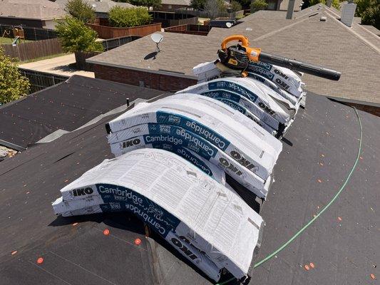 Bundles laying on roof before attaching