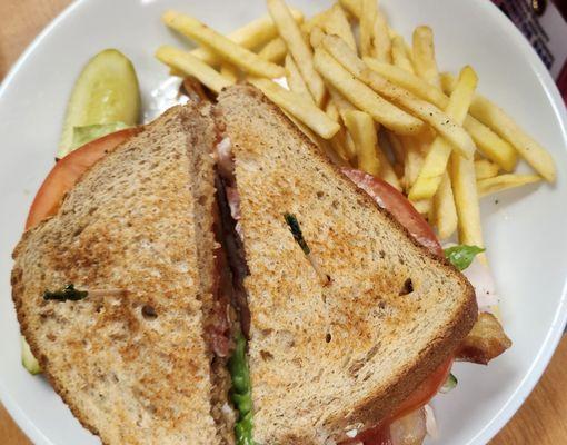 Turkey BLT with fries and pickle spear