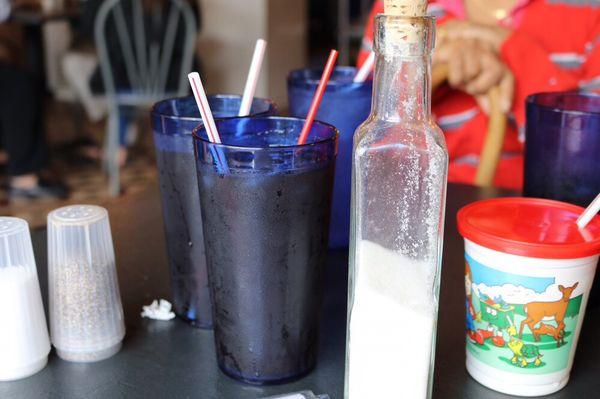 Iced tea with sugar served in a bottle.