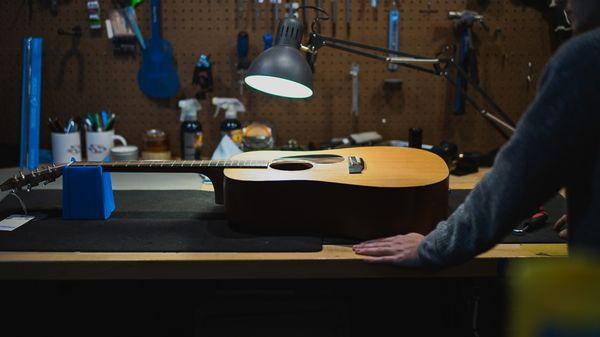 A guitar on the repair bench.