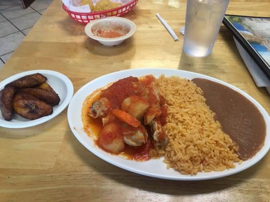 Stewed chicken, refried beans, and platano (Maduro.)