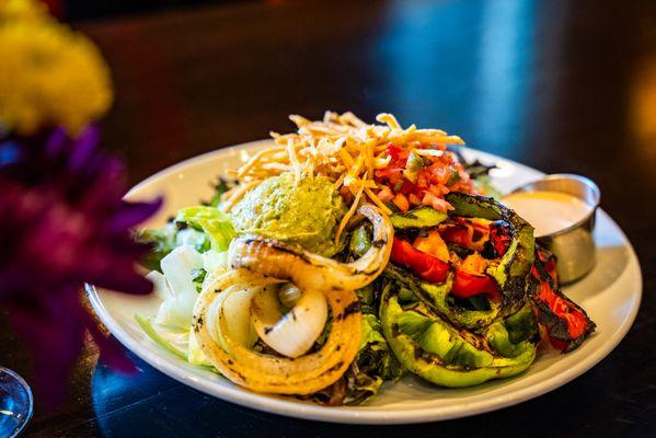 Fajita Salad with Mixed Greens, Grilled Onions & Peppers, Pico de Gallo, Guacamole, Crispy Tortilla Strips with Spicy Ranch Dressing