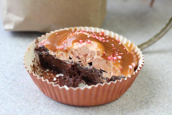 Inside of Ellen's Fine Goods GF chocolate cake with strawberry buttercream and tahini caramel ($8)