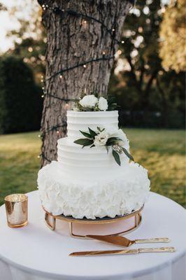 Flowers added by our florist, loved the bottom tier which featured fondant ruffles