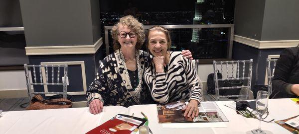 Betsy Hall and Liza Boubari (pictured at my complimentary vision board party. I bought a ticket to her 3E Event and hypnotherapy session.)