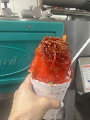 Watermelon flavor topped with salsaghetti candy, Chamoy and Chile