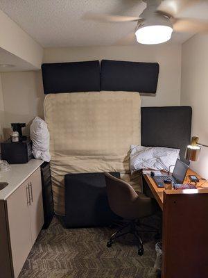 Fold out couch soundproof barrier - neighbor snoring problem solved.