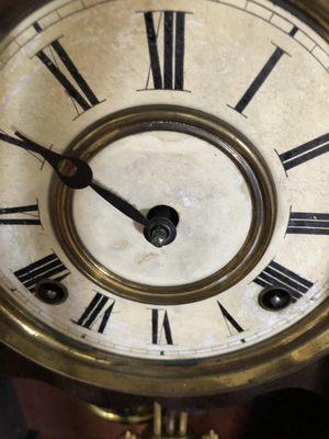 A clock missing the minute hand