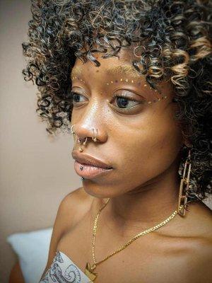 Multiple nose piercings, a septum piercing and a lip piercing. Almost Famous Body Piercing  in Champaign, Illinois.