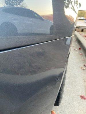 What dent?  Truly excellent repair work, and no rework of the original factory paint.  I love PDR!