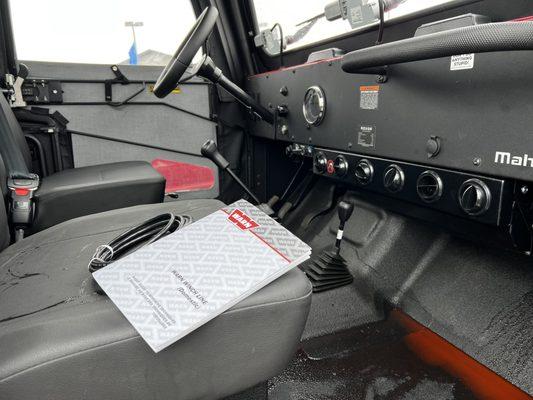 Orange/red fluid leaking from the heater core.