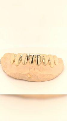 8 teeth 10k Gold Bottom grillz are always popular.  Very casual look that makes people stare..