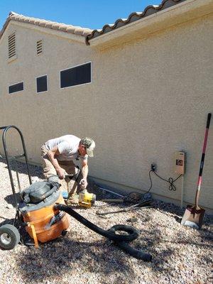 Beginning work to drill the 4-5" hole under the foundation.