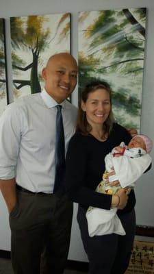 Dr. Daniel with one of his happy patients who received chiropractic care to relieve back pain through her pregnancy.