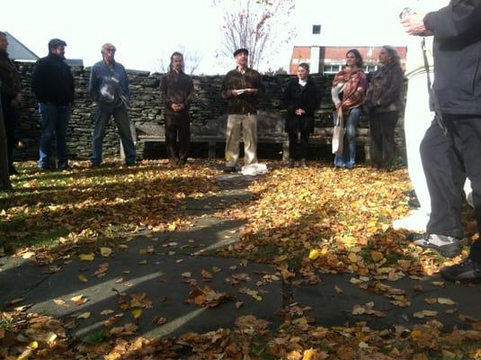 Gathering at the newly laid memorial plaque for those advisors & students who have passed away.