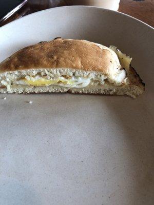 Half of the egg and cheese on an "English Muffin"