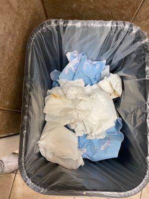 Garbage in the men's bathroom