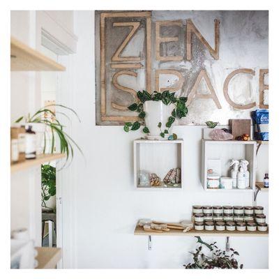 Zen space sign and product shelves.