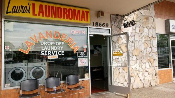 Front door with some waiting chairs, easy for disabled and rolling laundry carts.