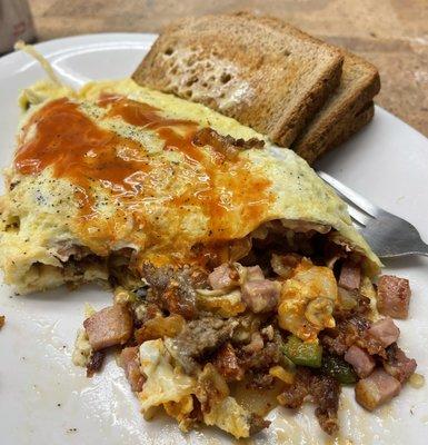 Al's omelette; full of veggies, cheese, & three types of delicious porcine muscle.  You won't leave here hungry, or broke!