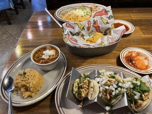 Chicken street tacos, rice, beans; beef quesadilla, rice, beans; chips, salsa