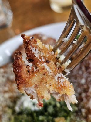 Close-up of the Pork Milanese main course.