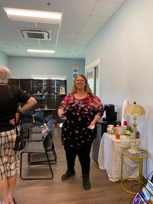 Angie D'Anjou, Spiritual Consultant giving a tour of the new facility to visitors at the Grand Opening.