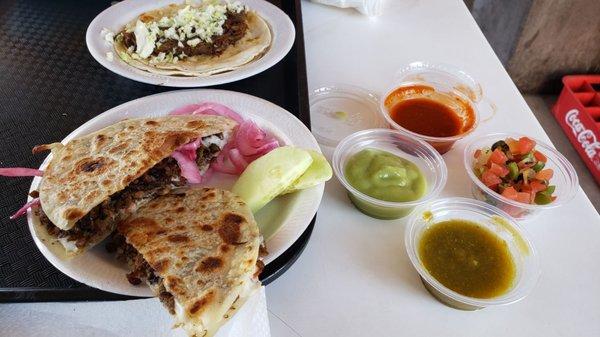 Small beef caramelo, my favorite, salsas, pickled onions and cucumbers from bar.