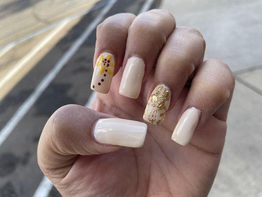 November mani, sunflower and gold flake accent.