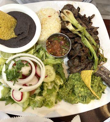 Steak with rice beans and salad