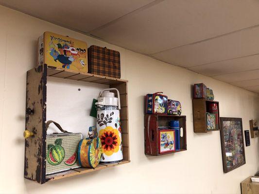 Lunch pails on the wall.