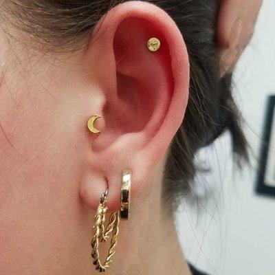 Tragus piercing at Addictions BodyArt Oregon