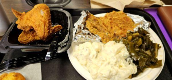 Fried pork chop, potato salad, collard greens and a wing