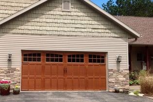 Carriage House Collection- The Carriage House Collection combines the beauty of a carriage-house door with the durability of steel.