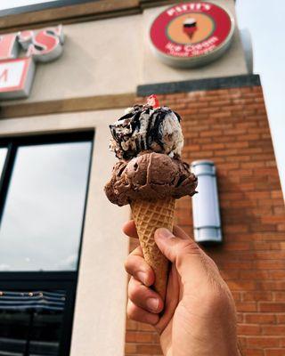 Zanzibar Chocolate and Moose Tracks ice cream in front of shop.