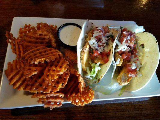 Buffalo Chicken Tacos with crispy sweet potato fries.