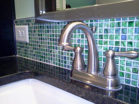 Glass mosaic vanity backsplash