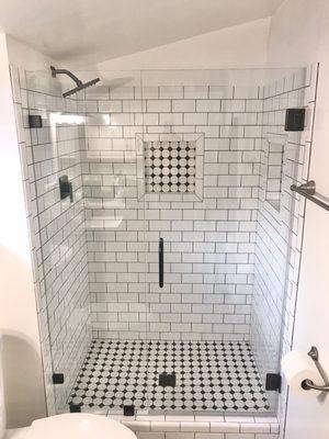 Frameless shower door by Vasquez Glass. Sturdy and gorgeous!