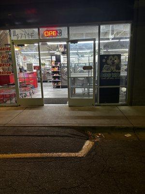 The entrance to the 24 hour laundromat right across the street from Sloans lake