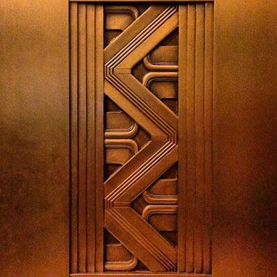 Art Deco (?) elevators. With a little Aztec in other areas of the building. Brilliant.