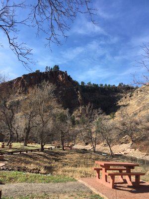 Gorgeous views of mountain with picnic tables nestled by stream