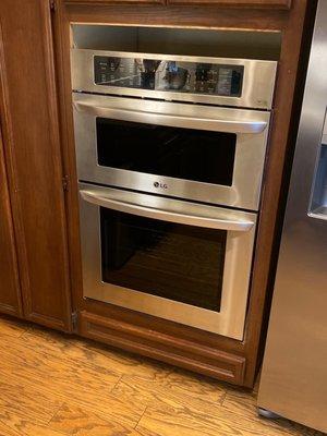 new microwave combo oven unit partially installed