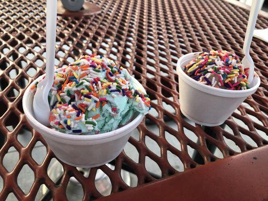 Two scoops of cotton candy and one scoop of chocolate.