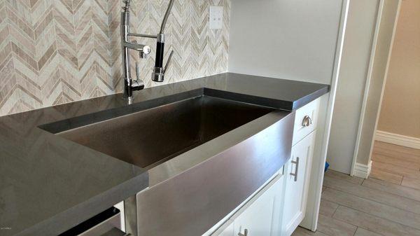 We specialize in designer touches like the herringbone backsplash and farm-style sink.